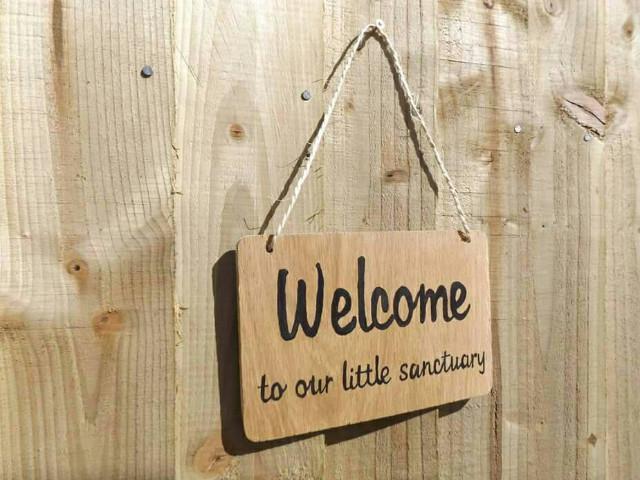 Welcome to our sanctuary oak wood sign