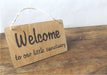 Welcome to our sanctuary oak wood sign