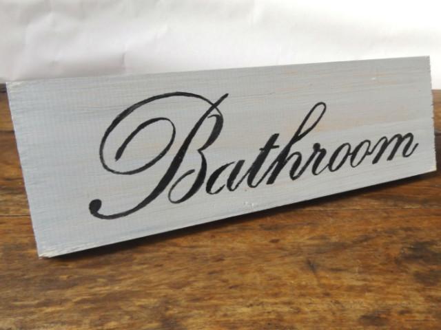Wooden bathroom sign